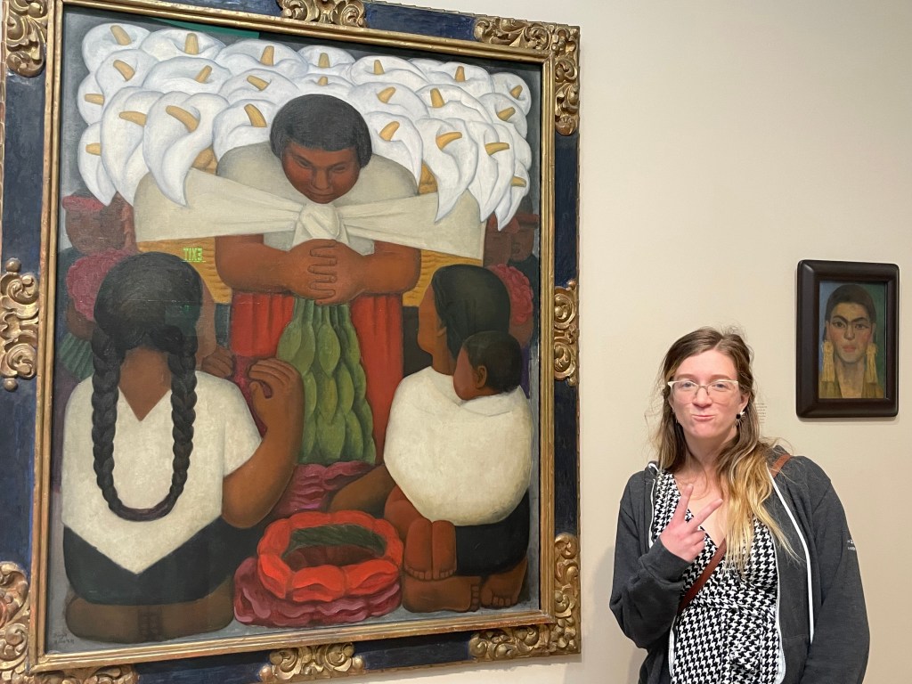 Monica in front of a Diego Rivera painting